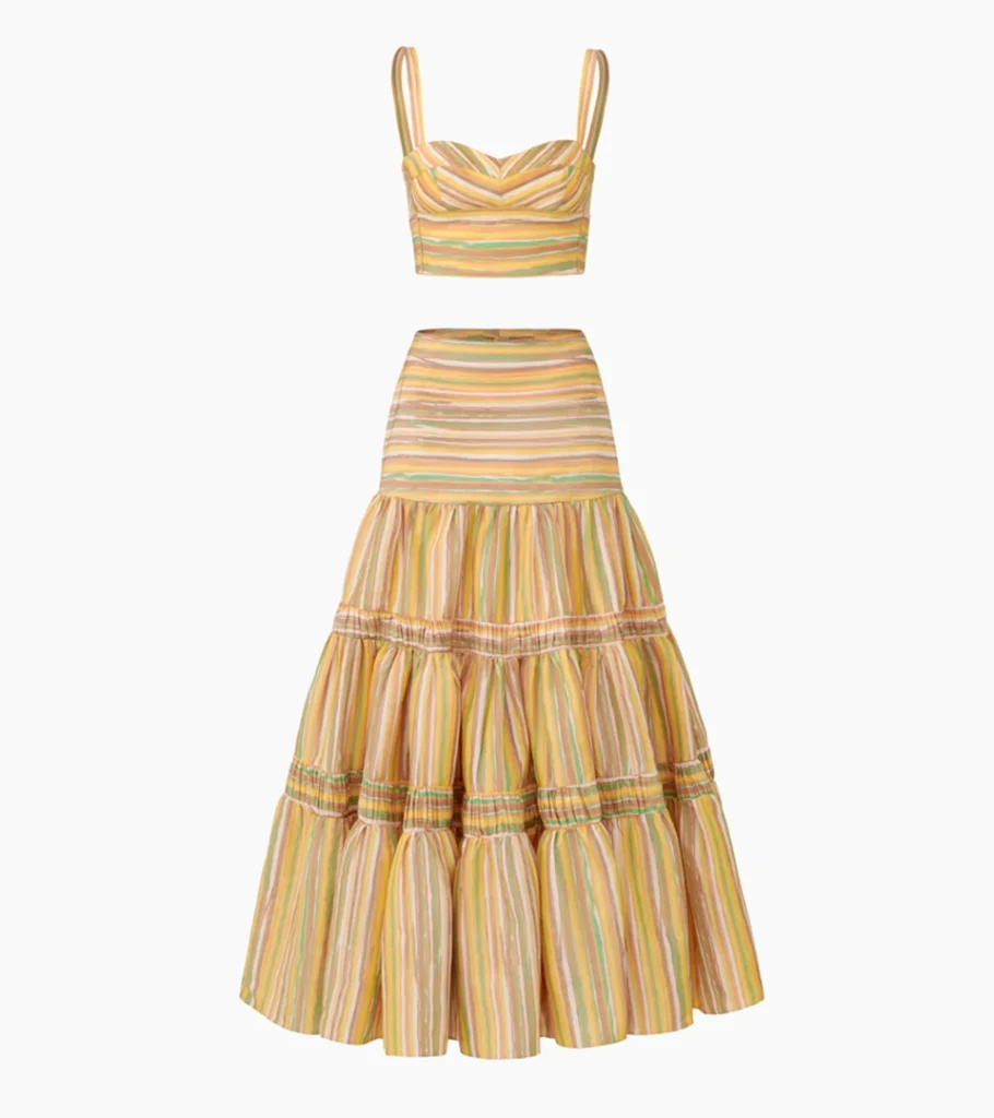 Professional ghost mannequin photography of a striped crop top and tiered maxi skirt set, displaying the natural garment shape for online apparel product photography.