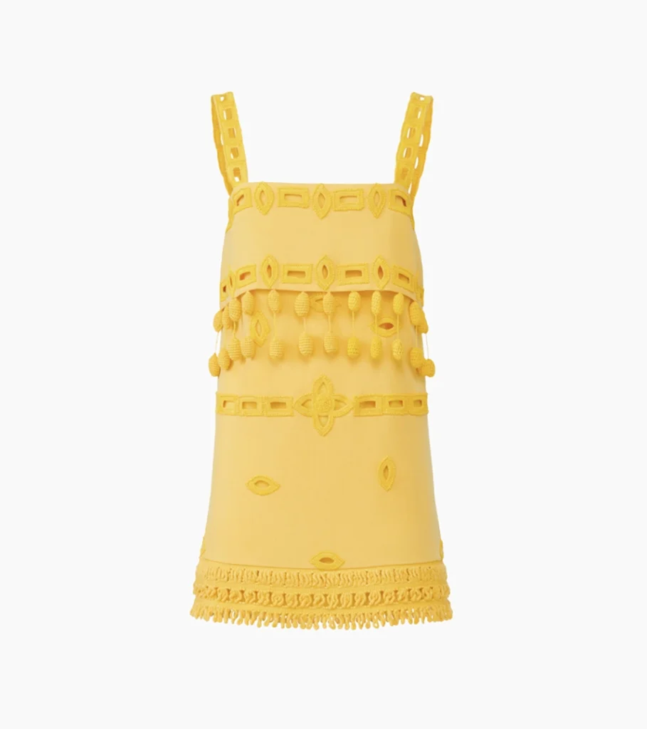 Ghost mannequin product photography of a yellow embellished mini dress with decorative trim, showcasing the garment shape and luxury fashion details for online clothing photography.