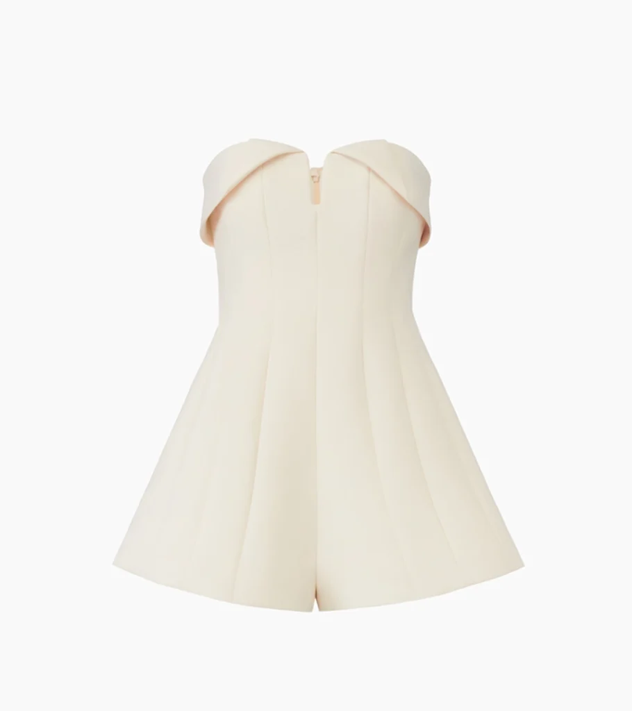 Invisible mannequin photography of an ivory strapless romper, emphasizing the structured silhouette and clean garment presentation for premium e-commerce apparel.