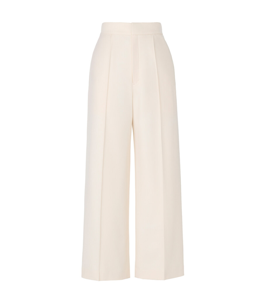 Invisible mannequin photography of cream wide-leg trousers, showcasing the garment drape, tailored silhouette, and clean e-commerce apparel presentation.