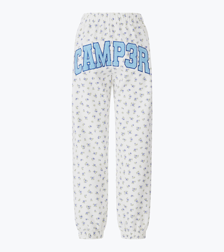 Ghost mannequin product photography of white graphic sweatpants with all-over print, displaying the garment shape and premium apparel details for fashion e-commerce.