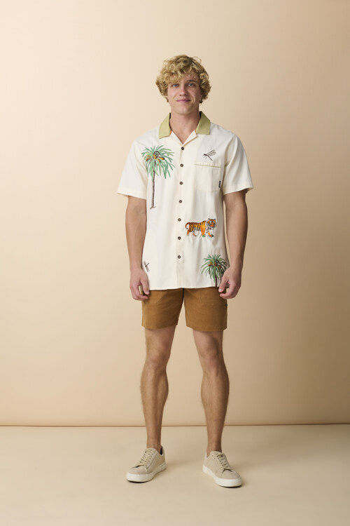Male model wearing embroidered camp shirt and shorts