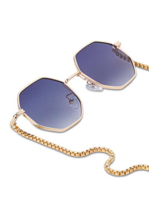 Close-up product photography of gold-framed octagonal sunglasses with blue gradient lenses and box-chain detail