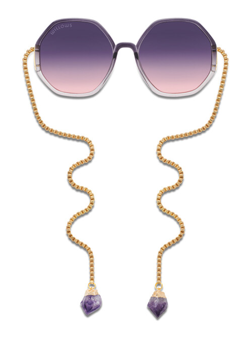 Product photography of purple gradient octagonal sunglasses with a gold box-chain and amethyst crystal drops