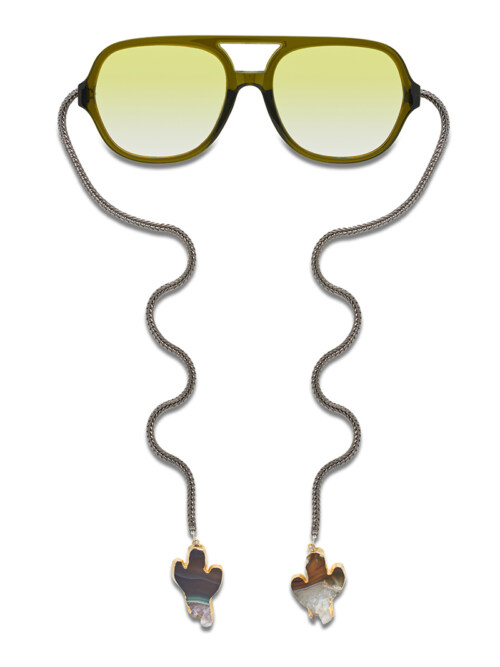 Product photography of olive green aviator sunglasses with a gunmetal chain and cactus-shaped stone charms