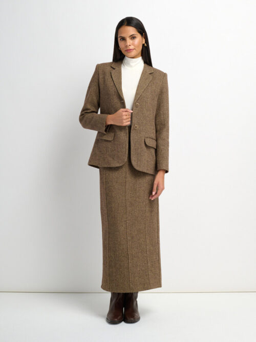 On-model photography of a brown tweed blazer and column midi skirt suit worn over a white turtleneck