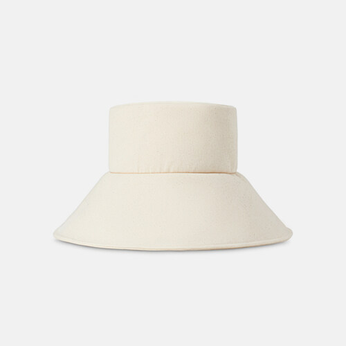 Product photography of a cream wide-brim bucket hat, front view on a light grey background