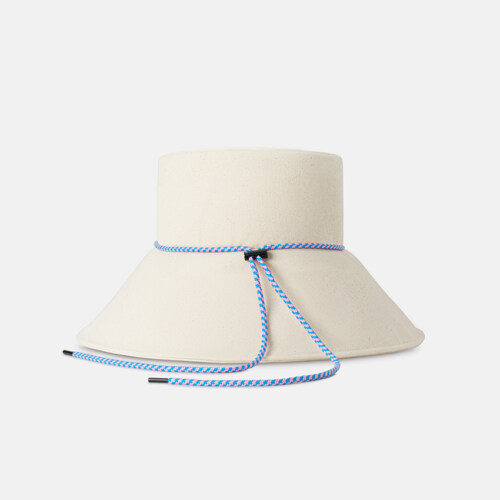 Product photography of a cream bucket hat with a blue and white patterned chin cord