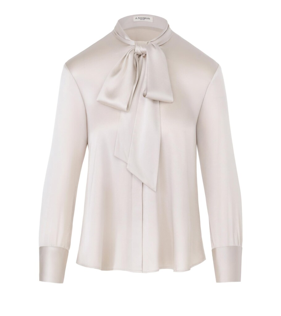 Ghost mannequin product photography of an ivory bow-neck blouse, emphasizing the elegant drape, neckline detail, and premium fashion construction for online clothing photography.