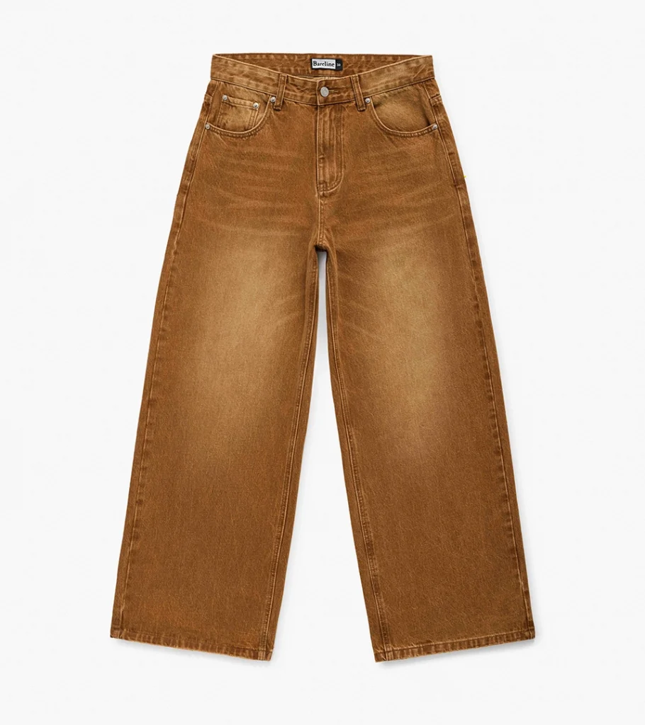 Flat lay photography of tan washed wide-leg jeans, top-down view
