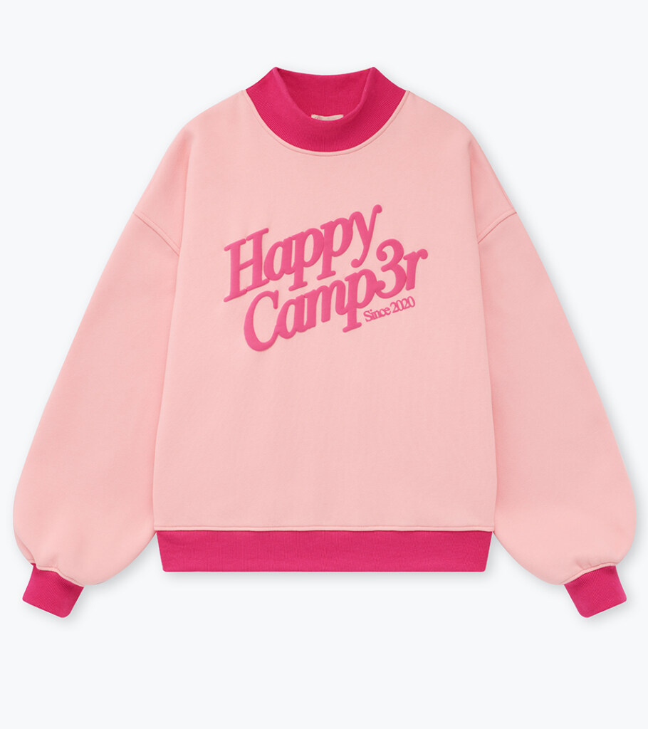 Flat lay photography of a pink graphic sweatshirt with contrast ribbed trim