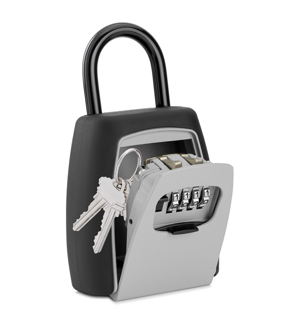 Product photography of a black and silver combination key lockbox with the compartment open and keys visible
