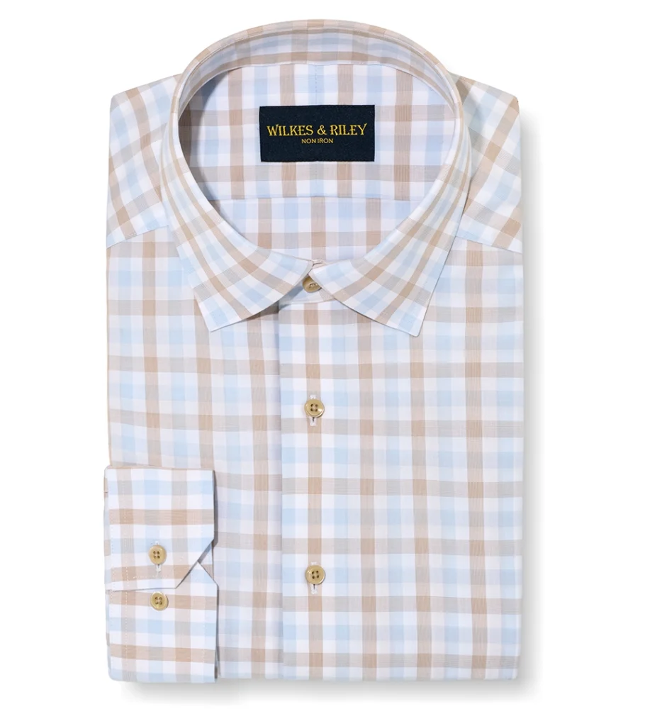Flat lay photography of a folded plaid dress shirt photographed for men's apparel e-commerce photography.