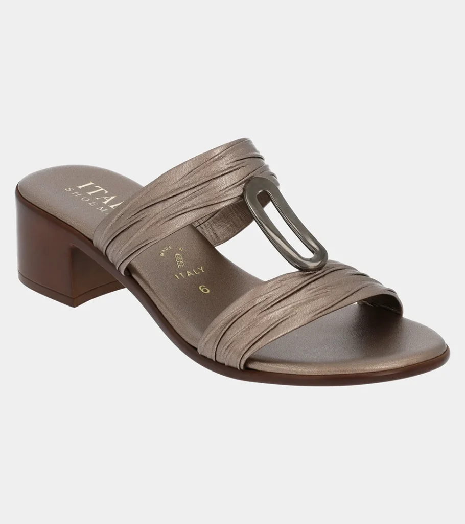 Automated product photography of a bronze metallic slide sandal with a T-bar strap and silver ring hardware, angled side view