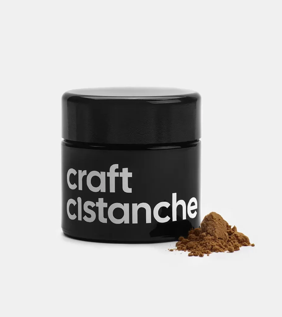 Product photography of a single black supplement jar with a small mound of loose powder beside it, on grey