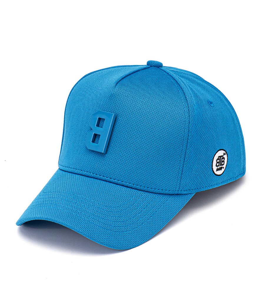 Product photography of a bright blue baseball cap with a side eyelet detail, angled side view