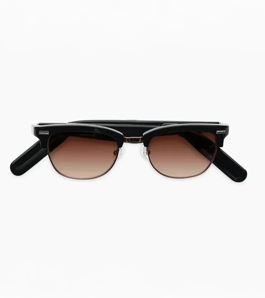 Product photography of black browline sunglasses with brown gradient lenses on a light background