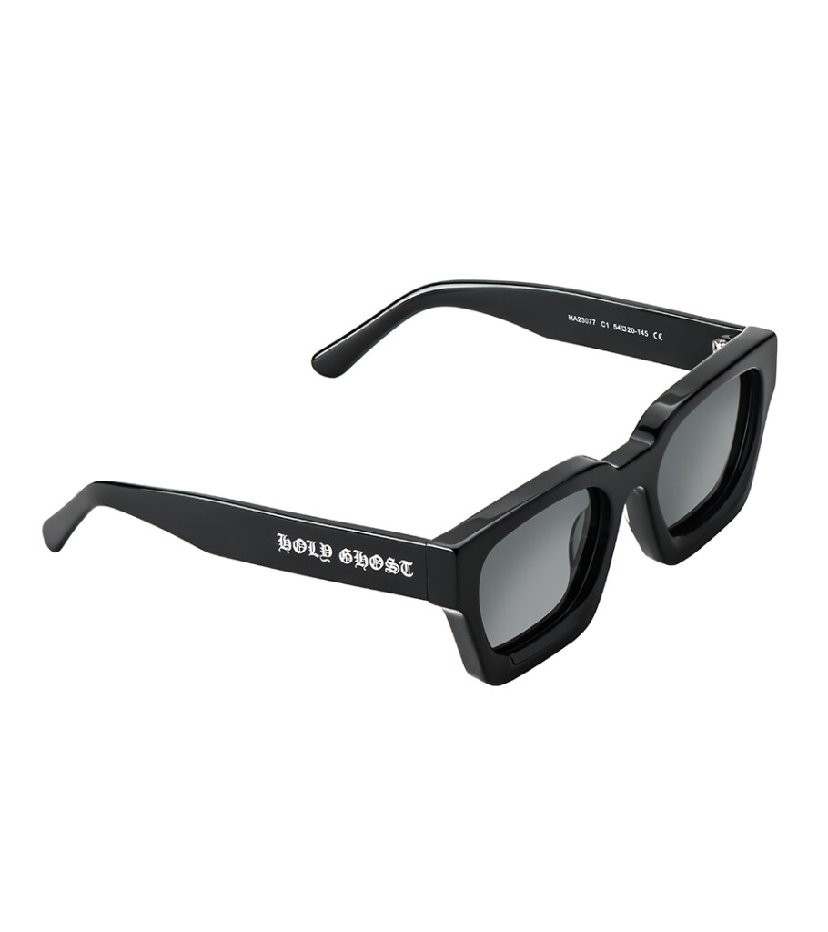 Product photography of black square-frame sunglasses with printed temple text, angled view