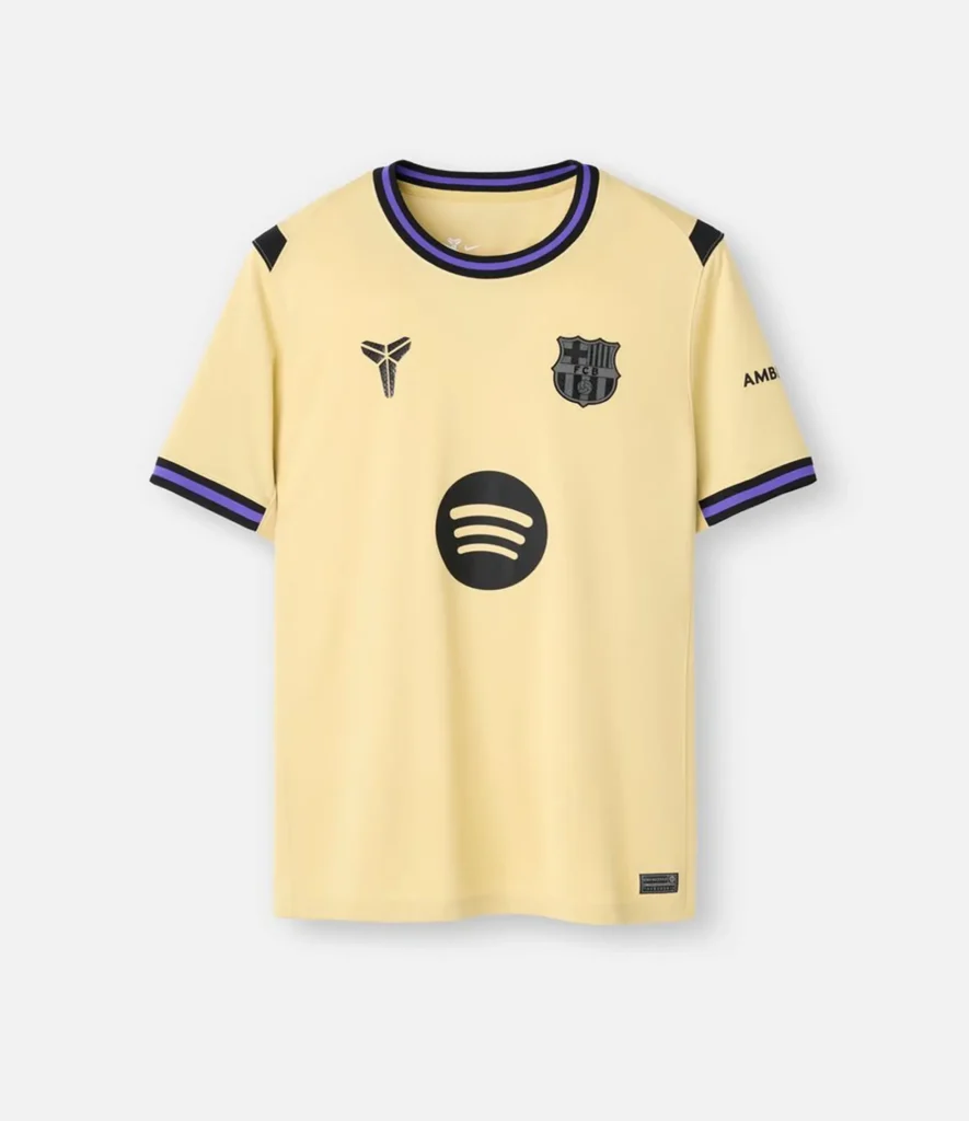 Flat lay clothing photography of a pale yellow soccer jersey with purple contrast trim