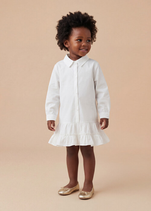 AI model photography of a white long-sleeve toddler shirt dress with ruffle hem, front view