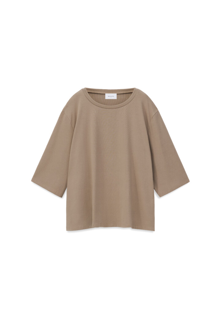 Fashion model product photography and videography studio. Taupe oversized boxy t-shirt on a clean white background.
