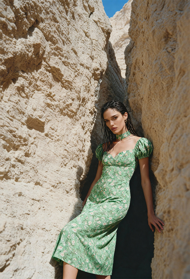 Hybrid AI model and product photography studio by Shootify. Fashion model in a green floral puff-sleeve midi dress posed in a sandstone rock canyon.