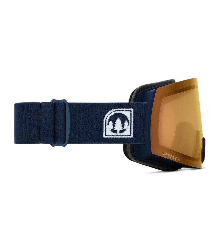 navy ski goggles with amber lens shown from side on white background for eyewear product photography