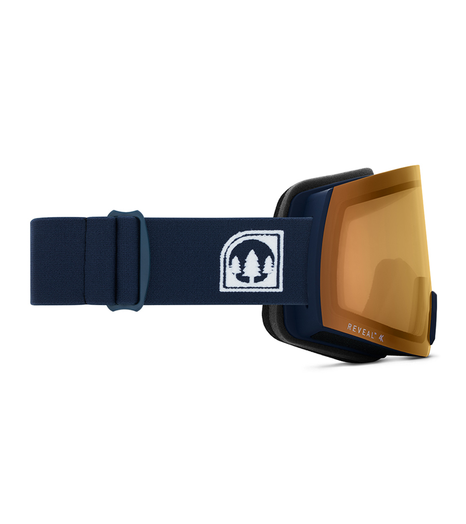 navy ski goggles with amber lens shown from side on white background for eyewear product photography