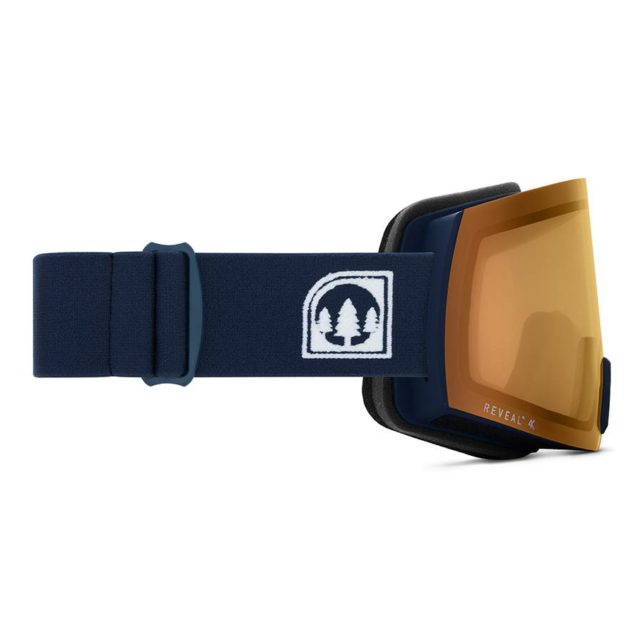 Sunglasses ecommerce product photography studio. Ski goggles with navy strap and tree-logo emblem shown from side on a white background.