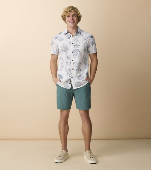 Front view of male model wearing tropical print camp shirt on a model photography