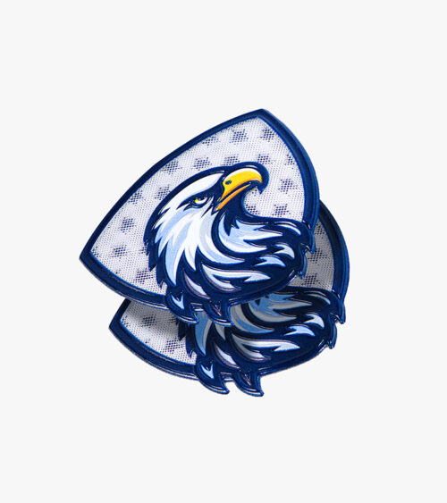 Custom product photography of stacked eagle emblem patches showing layered embroidery and stitch detail.