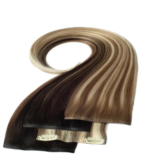 Hair extension photography of clip-in wefts in dark brown and highlighted blonde shades, styled in a swirl on white.