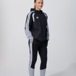 Female model in black adidas track jacket and leggings