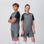 Two youth models in matching grey Puma soccer jerseys