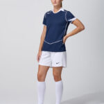 Female model in navy Nike soccer jersey