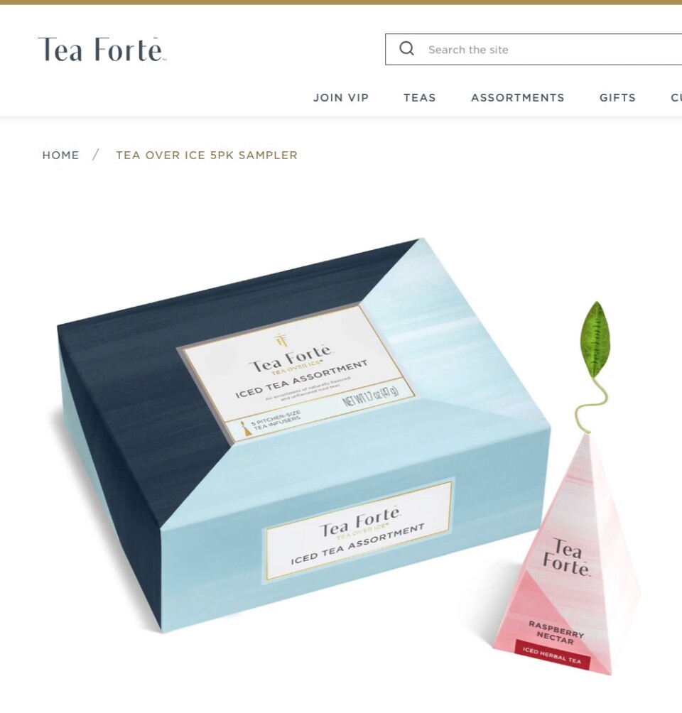 Shootify product photography of a closed Tea Forté iced tea assortment box beside a raspberry pyramid infuser, live on the brand's product page