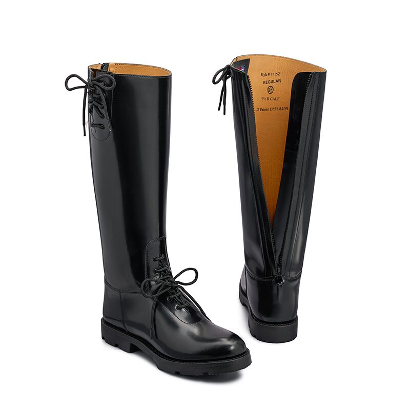 Product photography of a pair of black leather tall riding boots, one shown from the front and one from the inside showing the zip