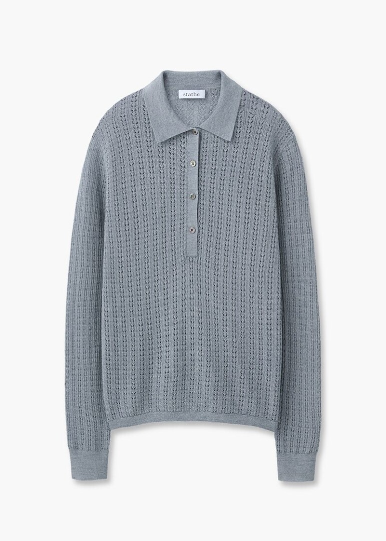 Flat lay product photography of a grey pointelle knit long-sleeve polo shirt, front view on pure white with no shadow