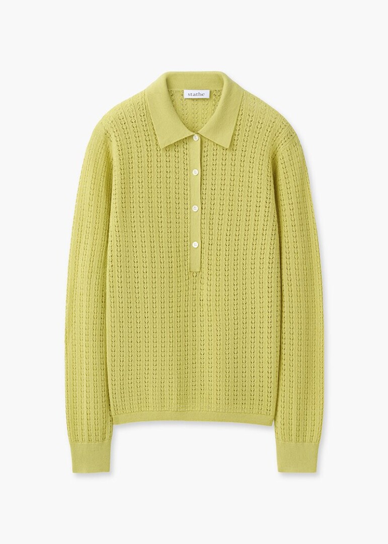 Flat lay product photography of a chartreuse pointelle knit long-sleeve polo shirt, front view on white