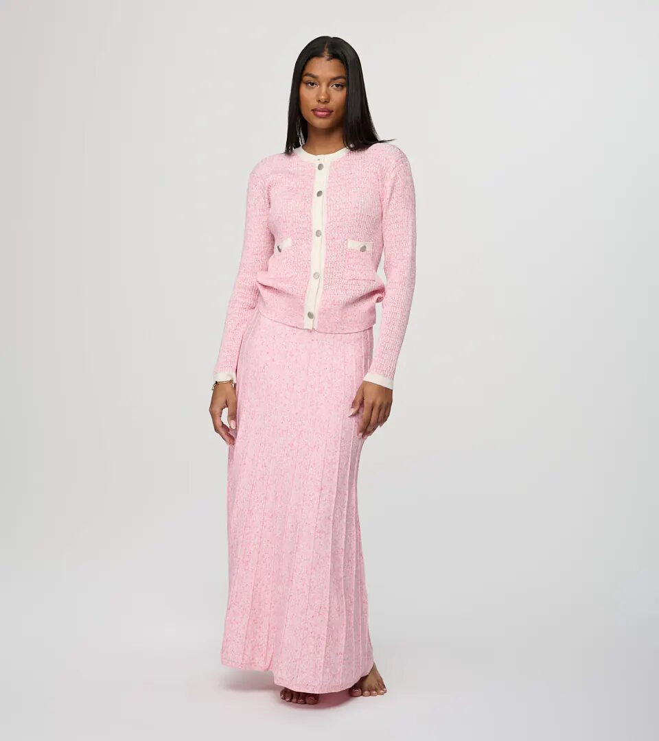 On-model photography of a pink marled knit cardigan with contrast trim worn with a matching pleated knit maxi skirt, full-length front view