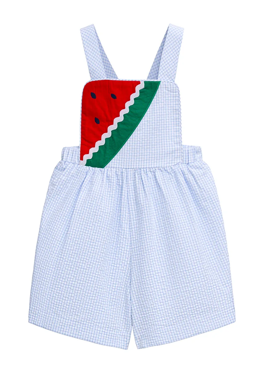 Light blue seersucker overall shortall with appliqué watermelon slice bib, styled flat lay on white