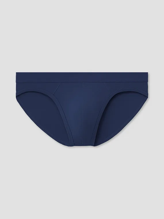 Navy men's brief photographed as a styled flat lay, front view