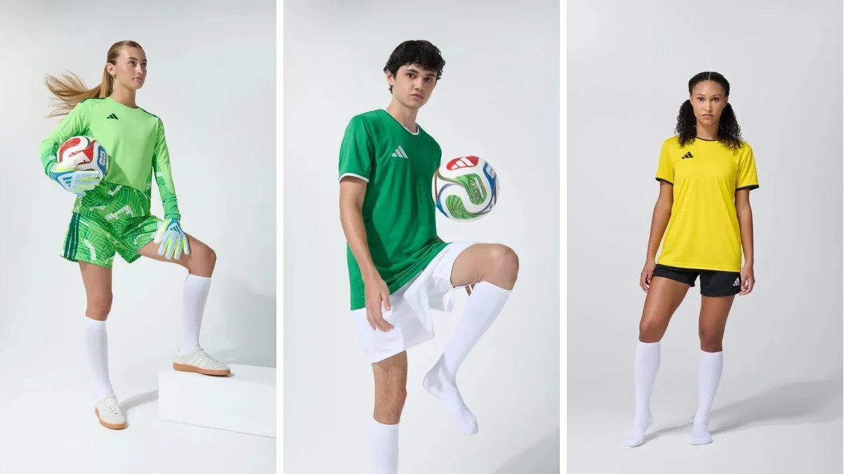 Three models in adidas football kits on a light studio background — green goalkeeper kit, green jersey with a ball and yellow jersey