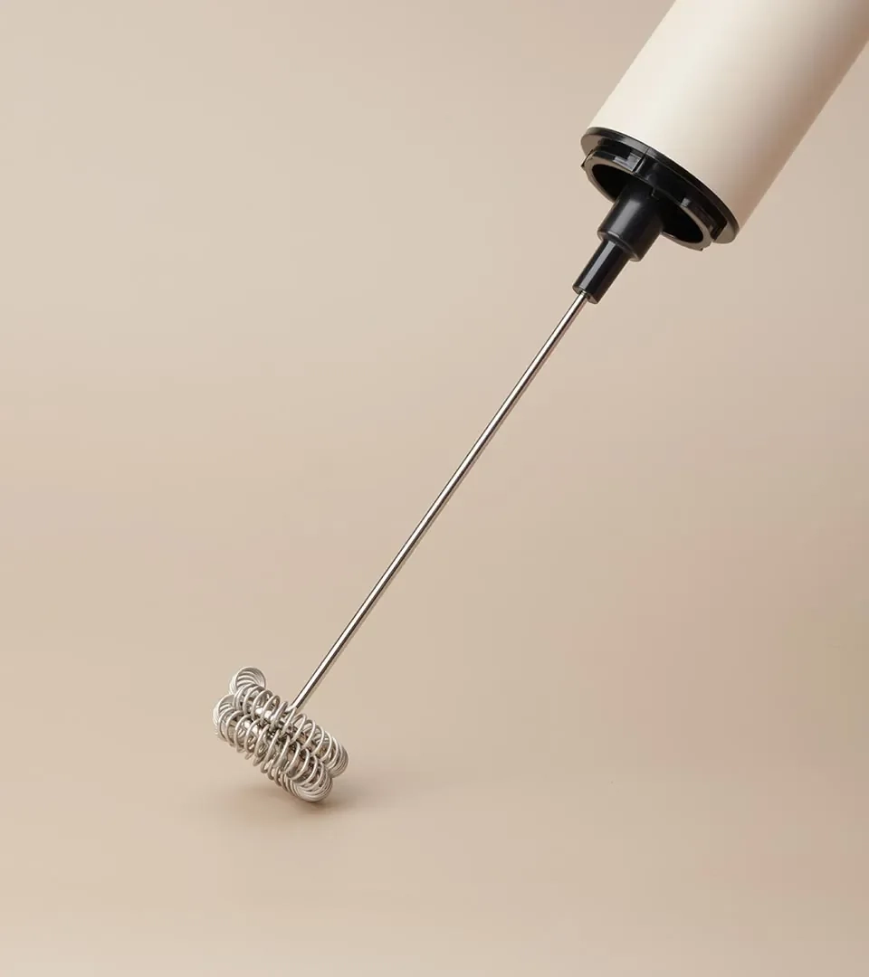 Detail product photography of a frother whisk and handle