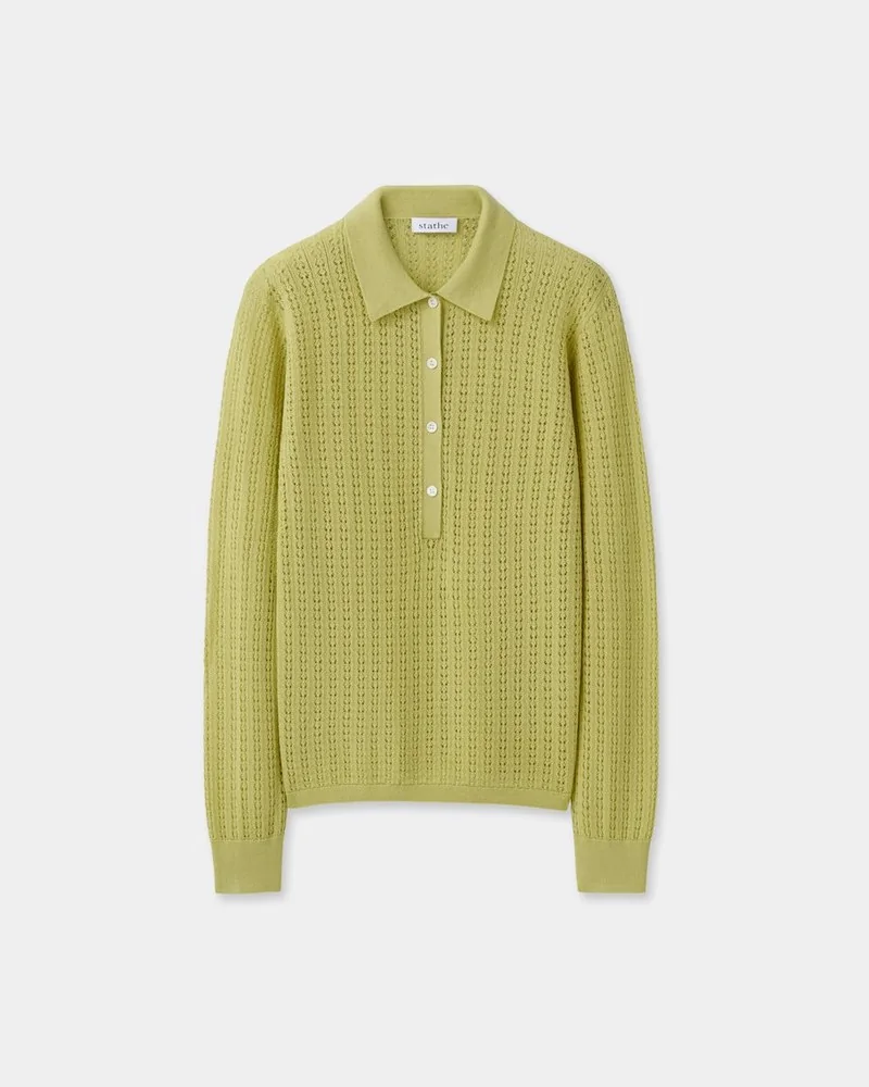 Flat lay of a yellow-green open-knit polo sweater
