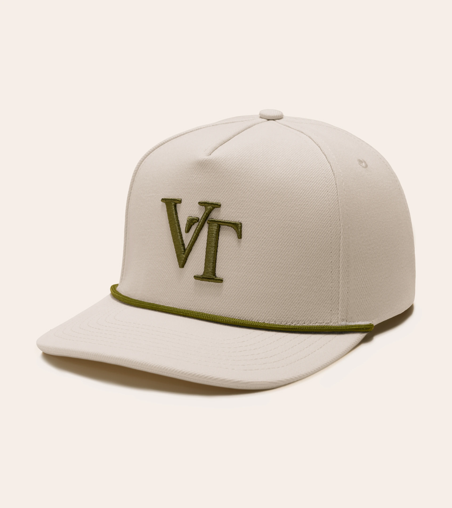 Hat photography of a cream rope snapback cap with an embroidered monogram