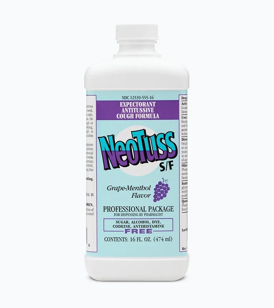 Pharmacy product photography of a cough formula bottle with a grape-menthol label