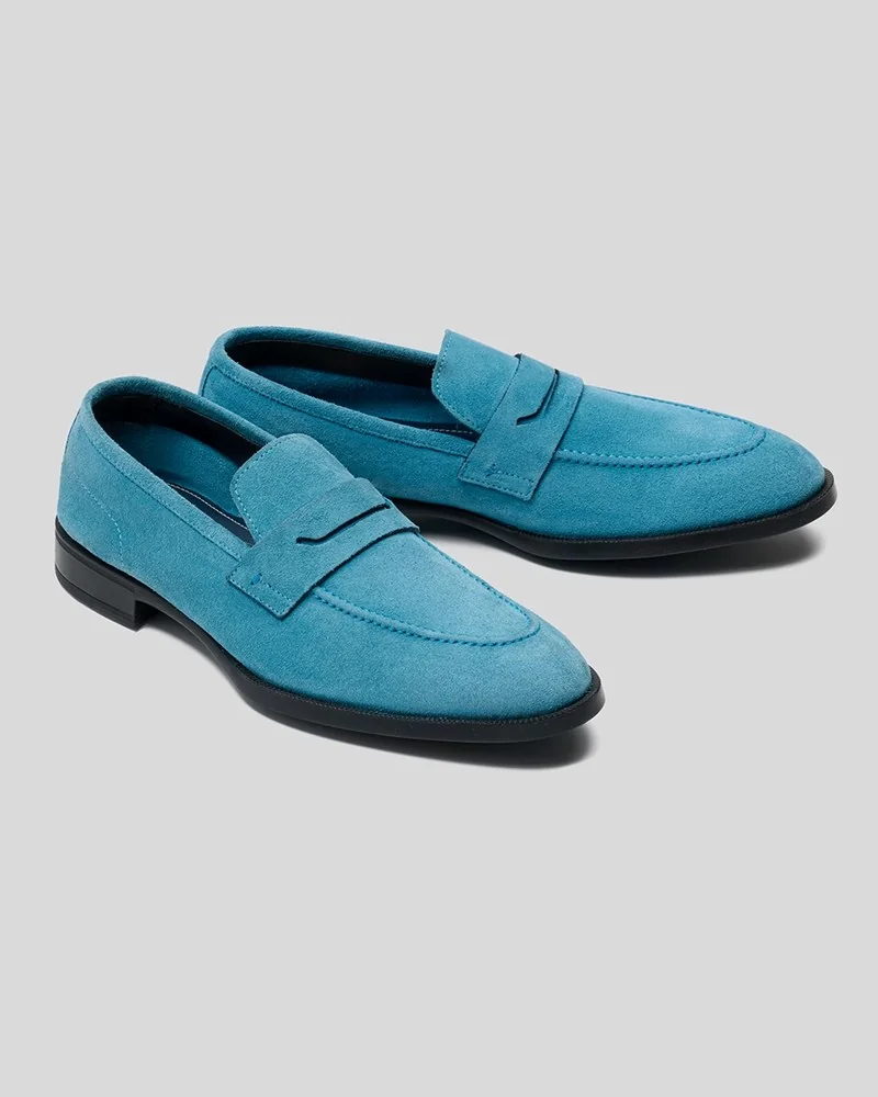 Pair of blue suede penny loafers