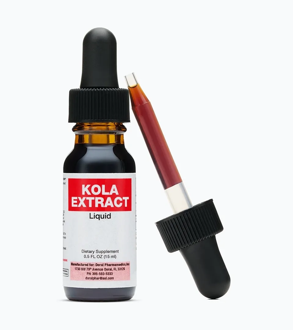 Supplement photography of a kola extract dropper bottle with the dropper beside it