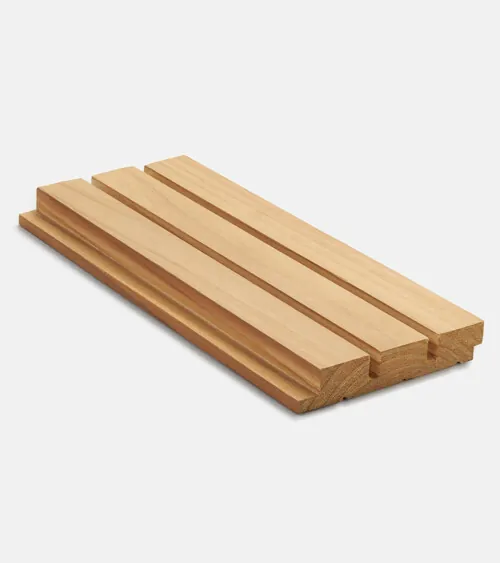 Light oak acoustic wood slat wall panel sample photographed at angle on white background, studio product photography